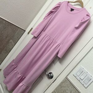 Woman dress sizeXXL it has pockets nice material starch